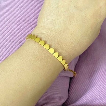 18K Gold Mini Hearts Bracelet: Elegant and Timeless Layered Look